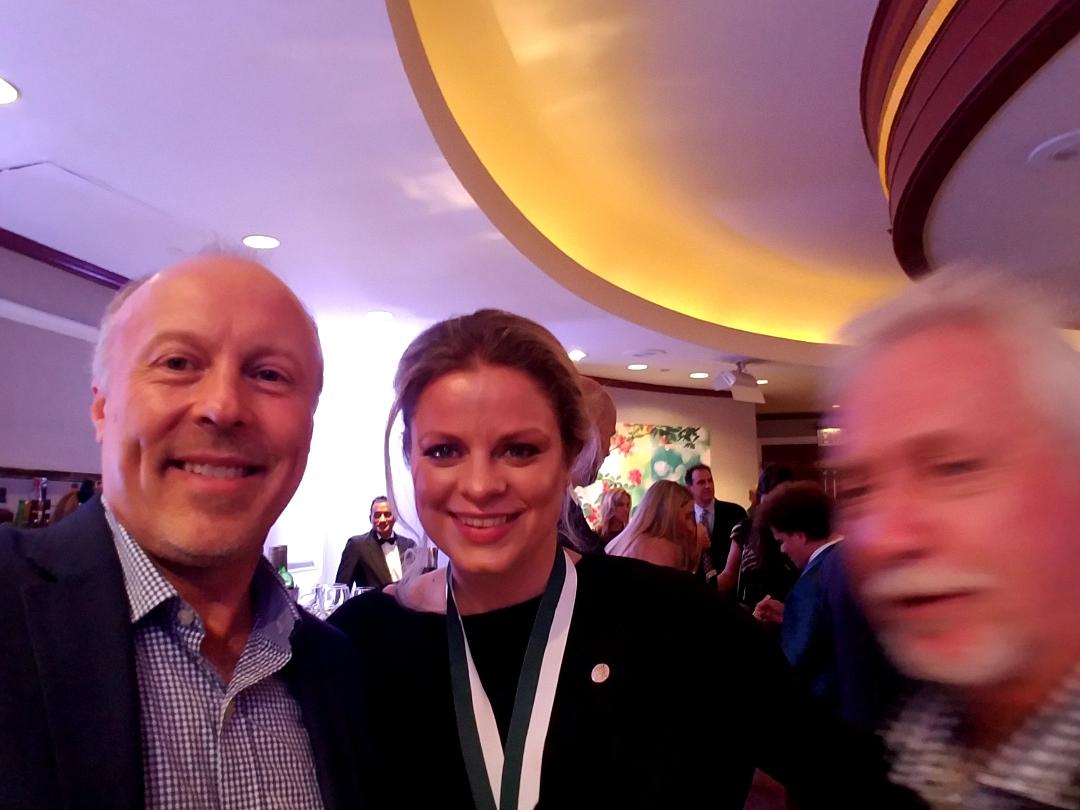 A guest photographed with a former world number one tennis champion at a VIP event