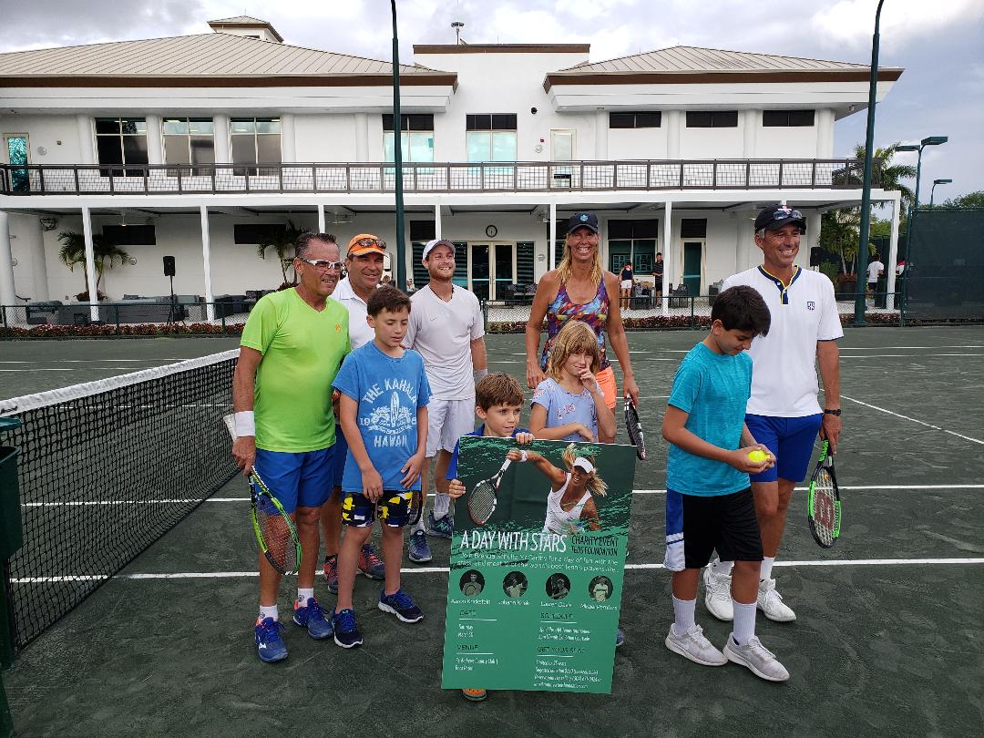 Former tennis professionals Aaron Krickstein, Johan Kriek, Brenda Schultz and Mikael Pernfors on court with junior players at a charity VIP event
