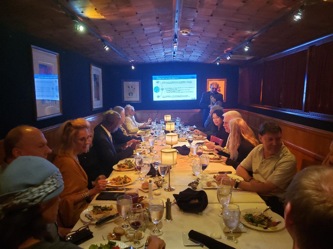 An evening presentation in a candlelit private dining room